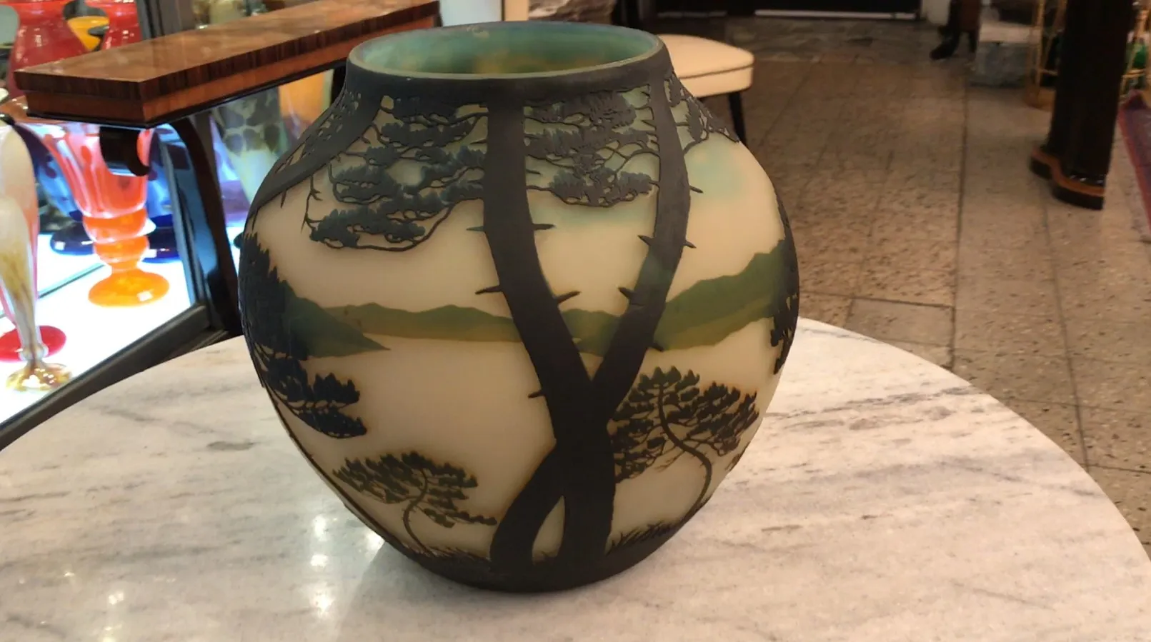 antique glass vase featuring tree designs