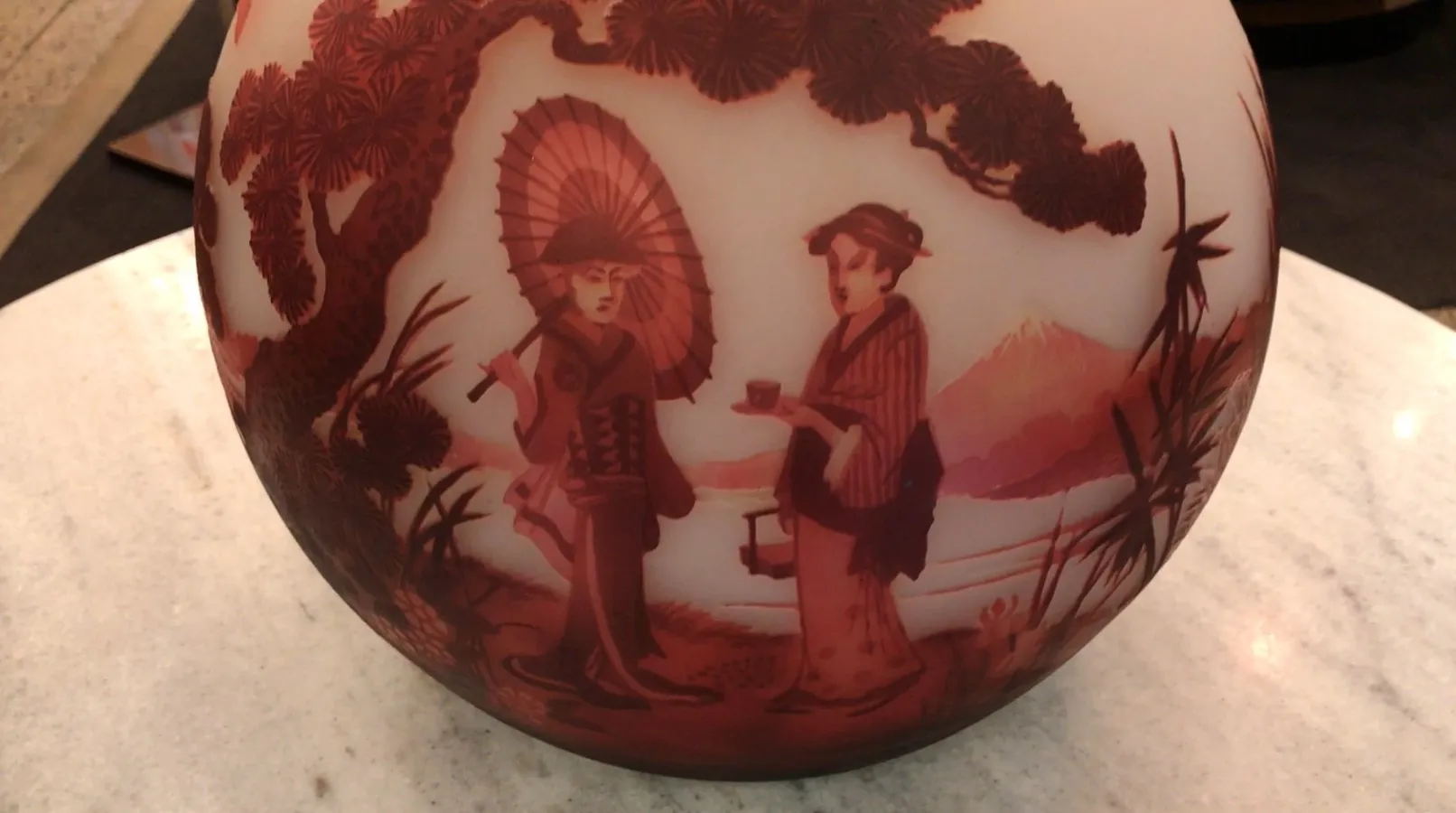 antique glass with signed design featuring characters