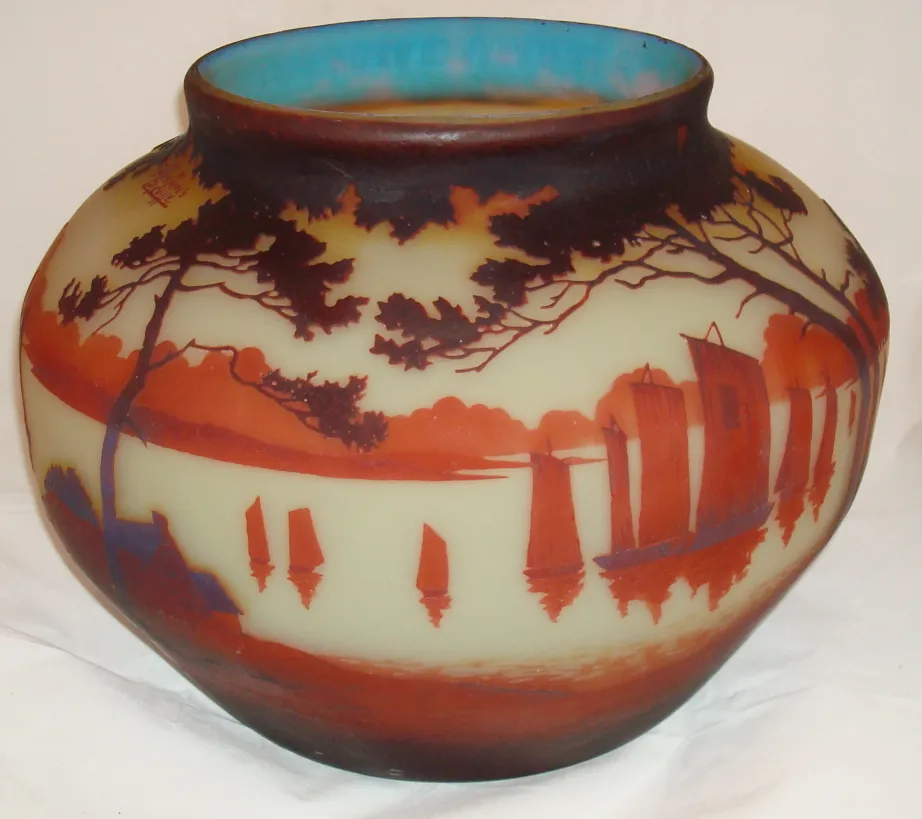 glass jar signed by muller fres featuring landscapes