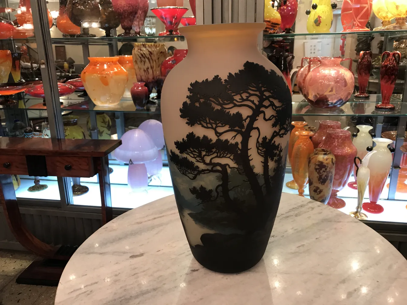 Elegant piece of signed glass with Muller Fres design, featuring a dark background and decorative trees.