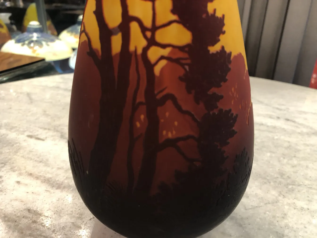 Signed glass Muller Fres featuring a tree design in a natural setting.