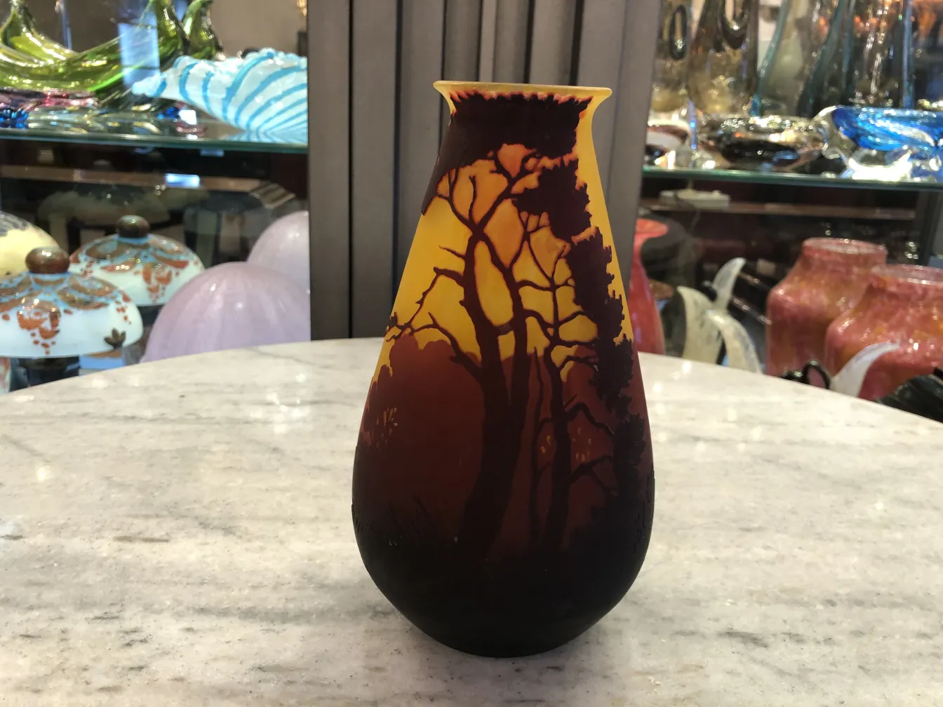 Antique vase featuring natural landscapes, signed by Muller Freres.