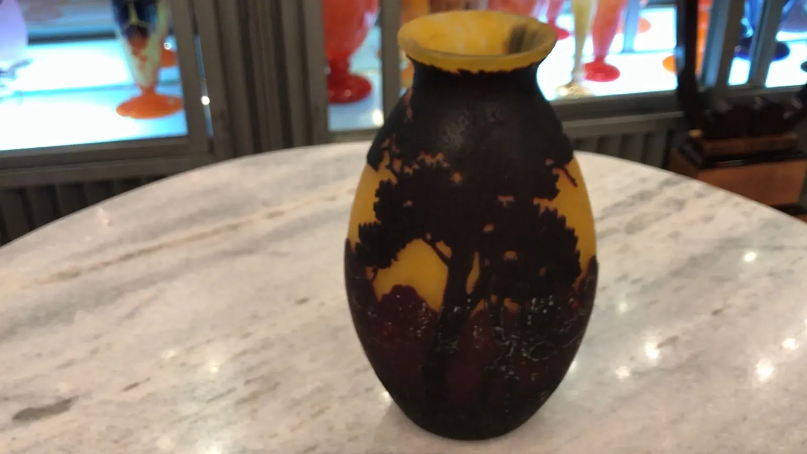 Antique signed glass by Muller Freres featuring a naturalistic tree design.