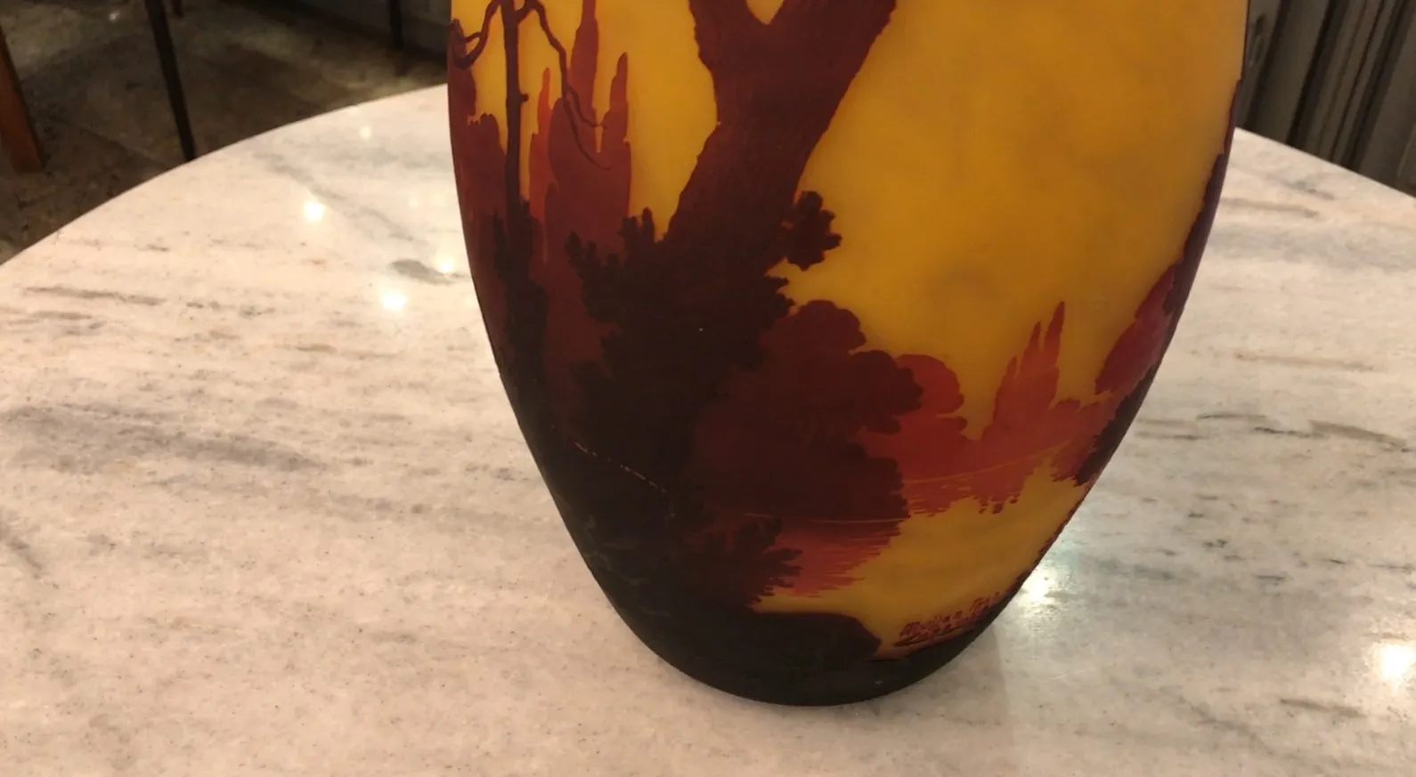 Signed glass Muller Fres featuring warm tones and organic shapes, antique atmosphere.