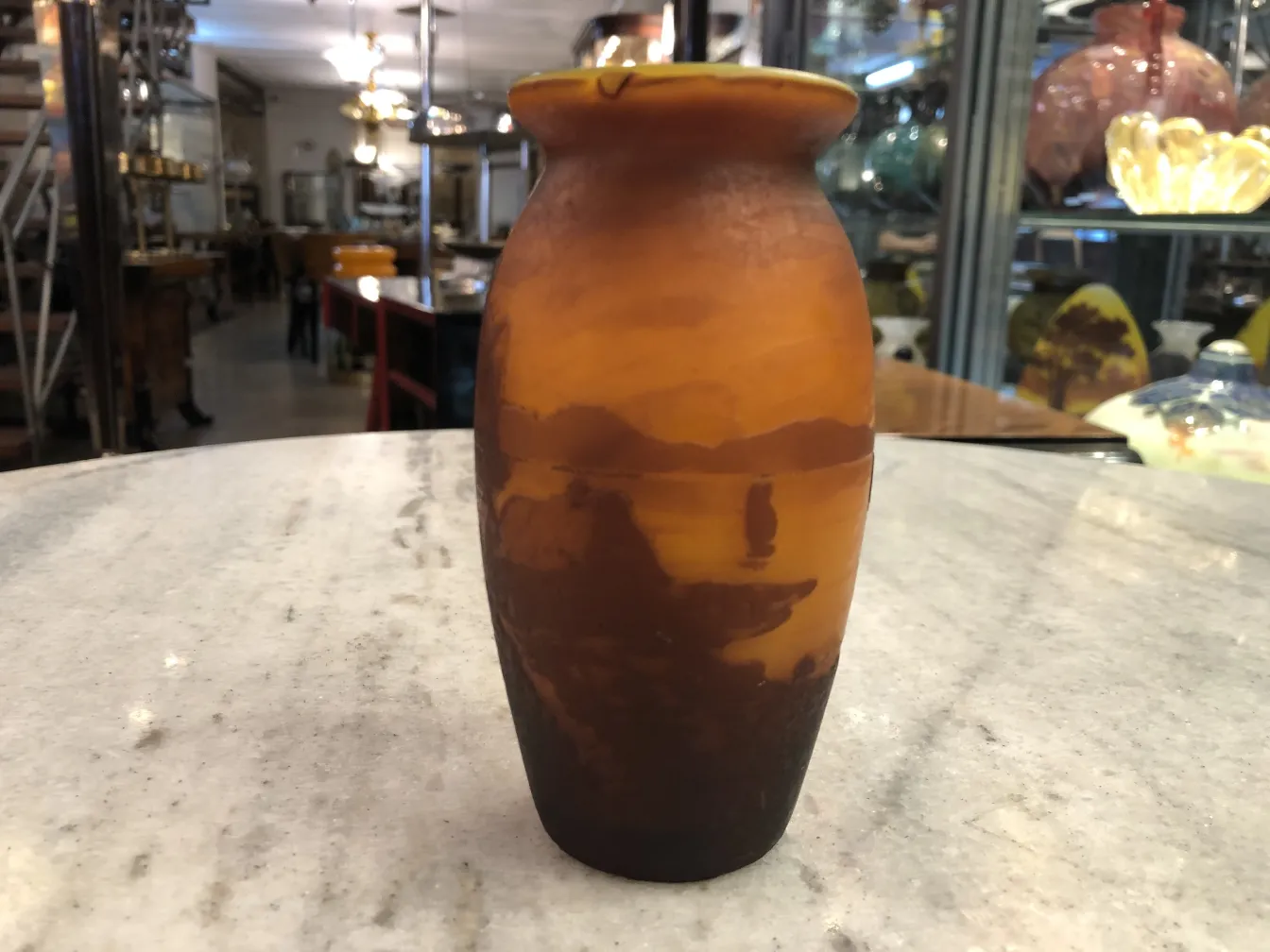 Antique signed glass Muller Fres with distinct finish in a classical setting.