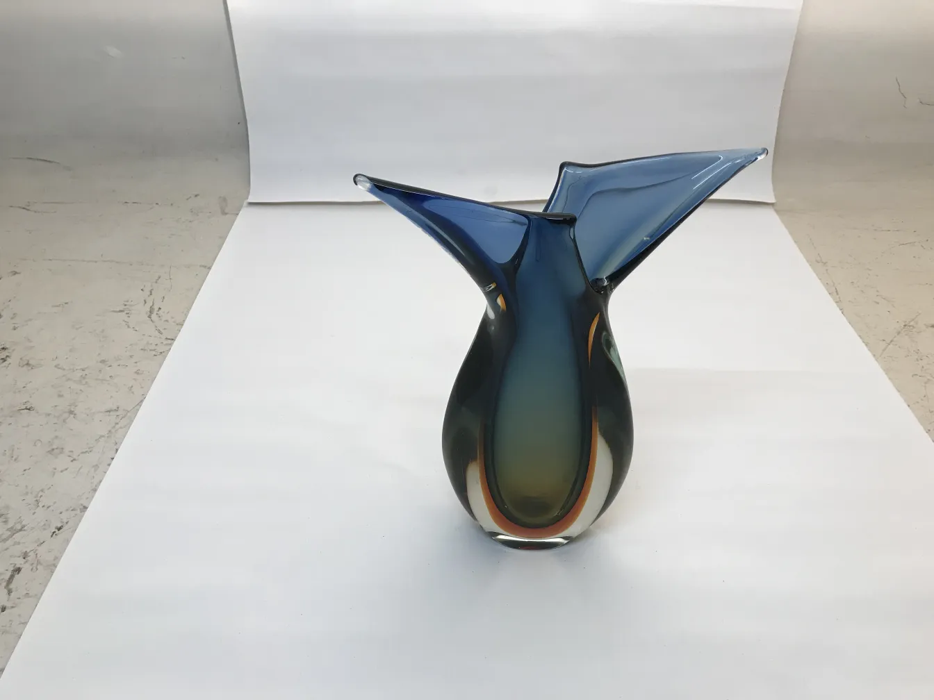murano vase in blue and green tones, elegant modern shape on white background