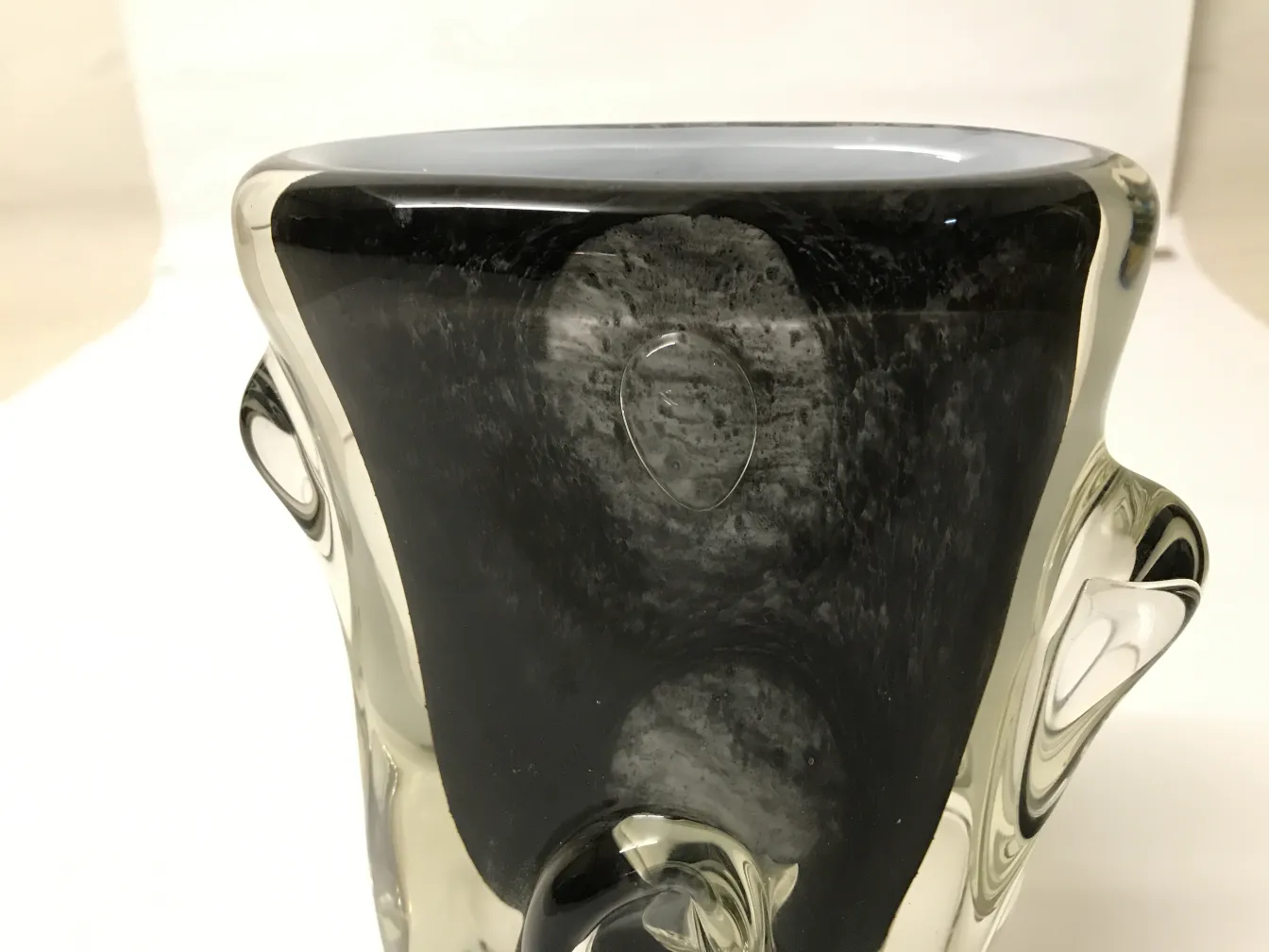 Antique Murano vase with unique decorative features.