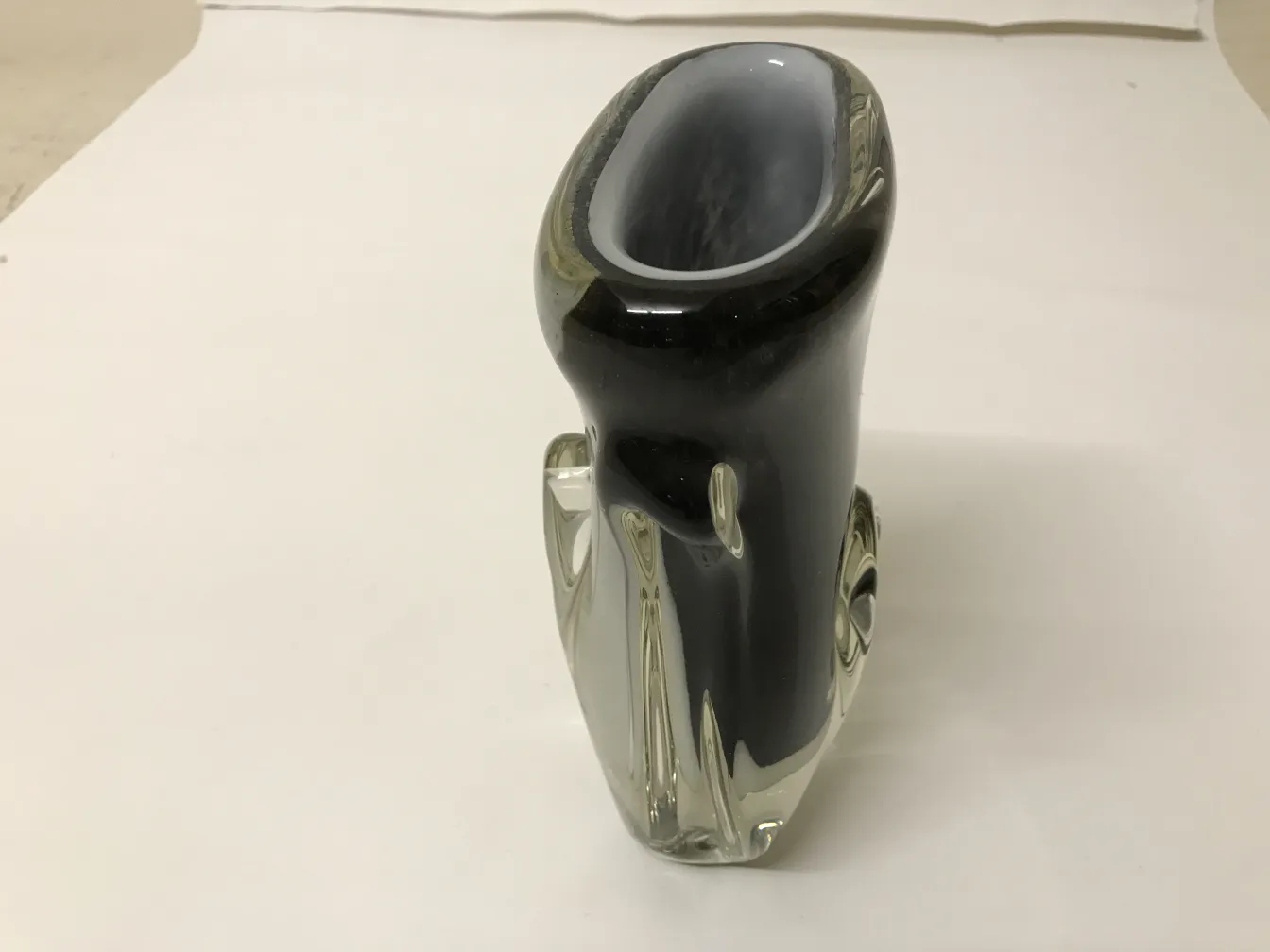 dark-colored murano vase with elegant design in neutral setting