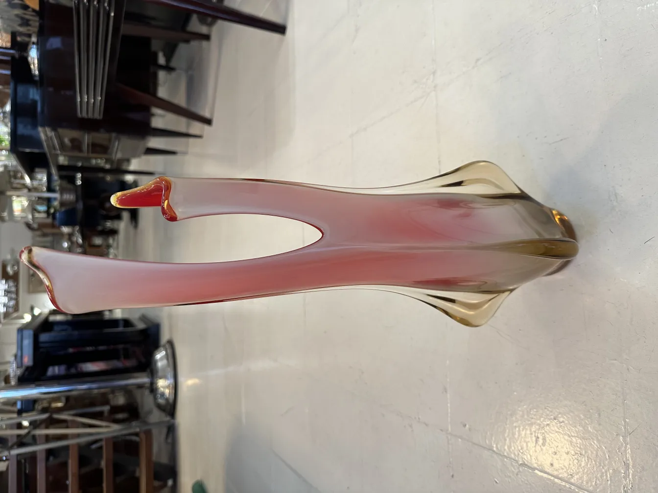 Antique Murano vase with beautiful colors and elegant shapes, enhancing a classic ambiance.