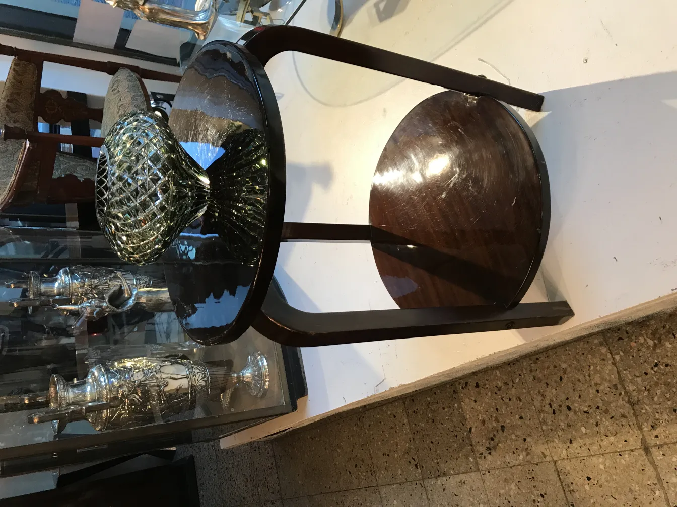 Murano vase with unique shape and vibrant colors on antique table.