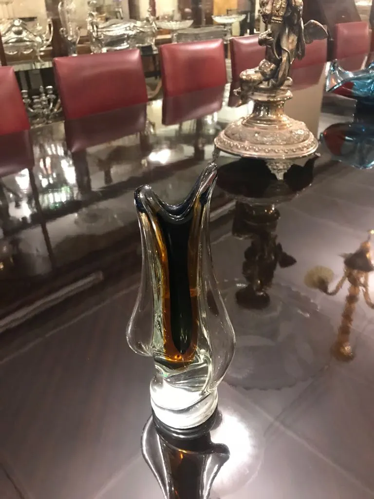 stylized murano vase on table with elegant surroundings