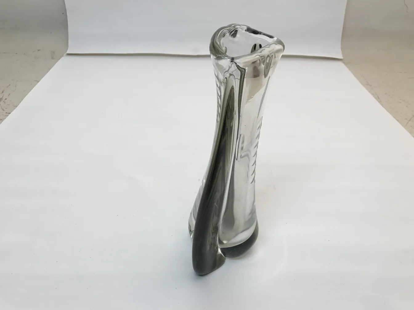 antique Murano vase with curved elegant design in light color on white background