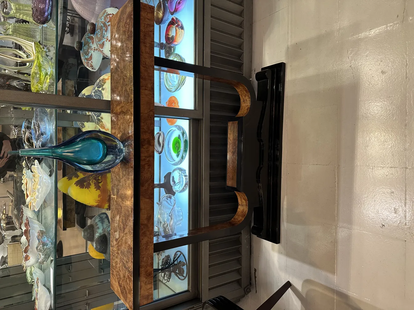 antique murano vase on display with other glass items