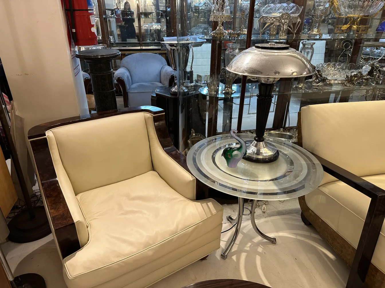 Antique Murano decorative sculpture in display room, with armchairs and lamp