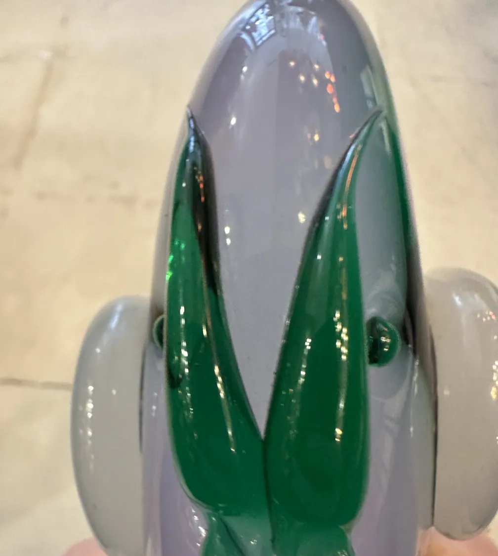 antique murano sculpture with elegant details and bright colors in a display setting