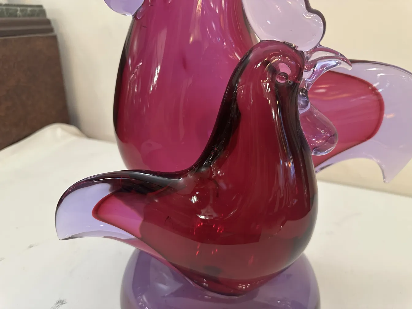 antique murano sculpture in shades of purple and red, bird shape