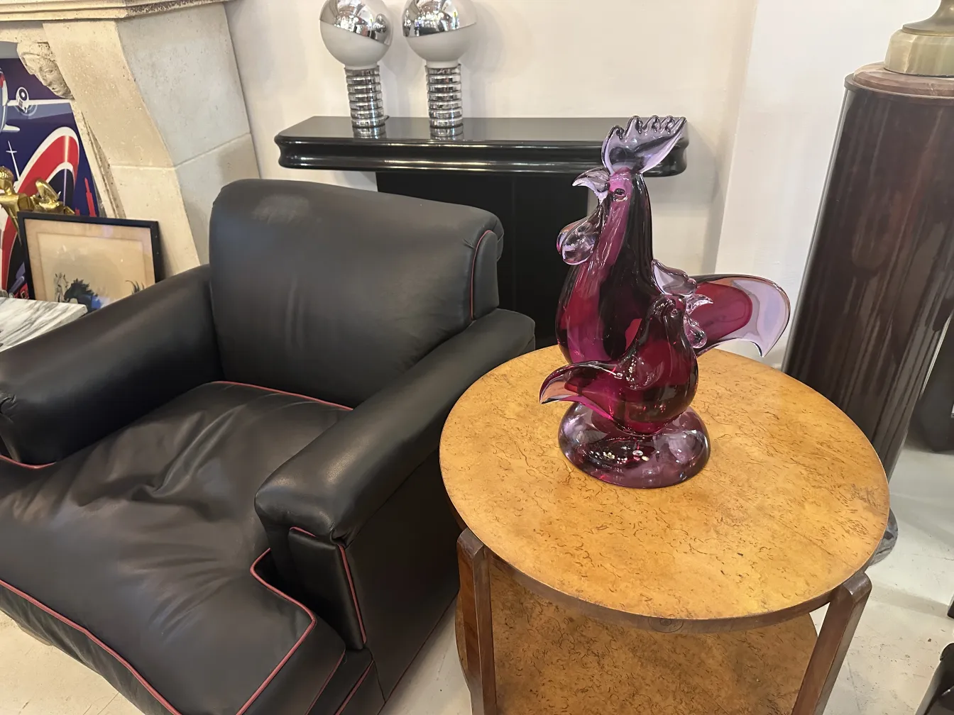 colorful rooster murano sculpture displayed on a table