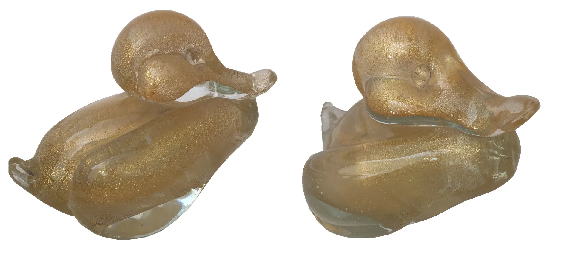 Antique murano sculpture shaped like a decorative duck with shiny details.