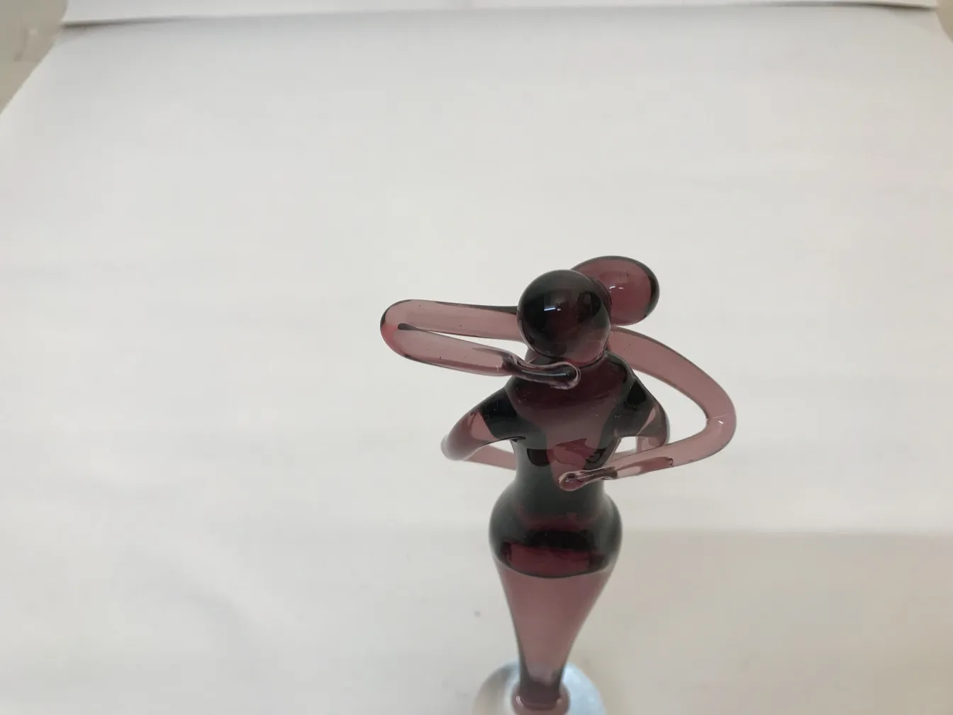 Antique Murano sculpture featuring a stylized figure in purple tones