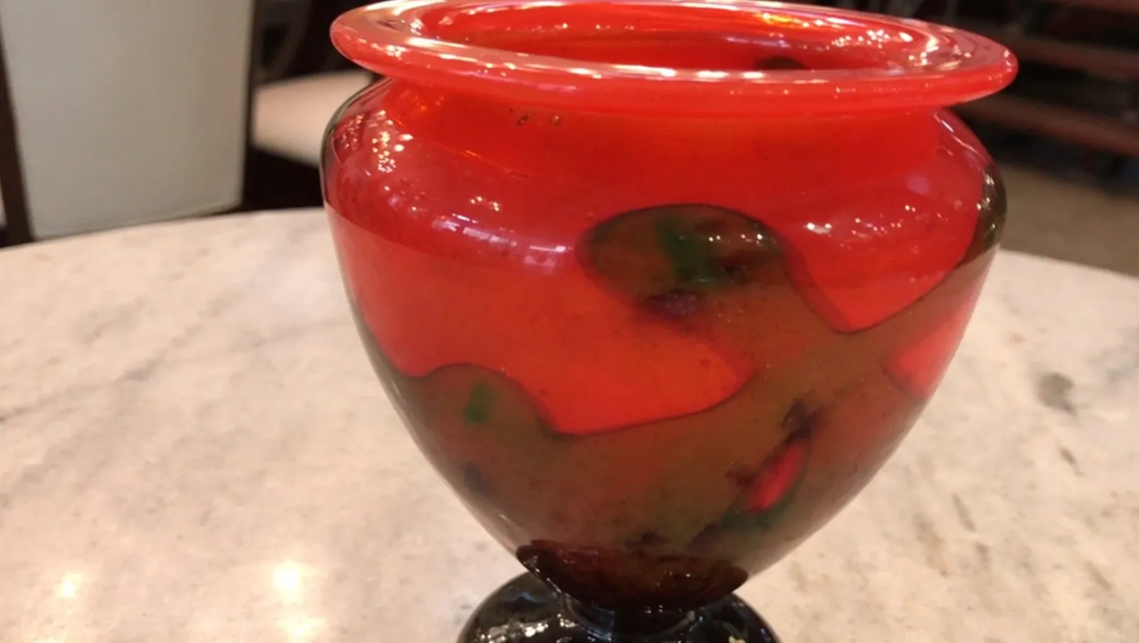 Signed glass by Schneider in an antique setting, vibrant red color.