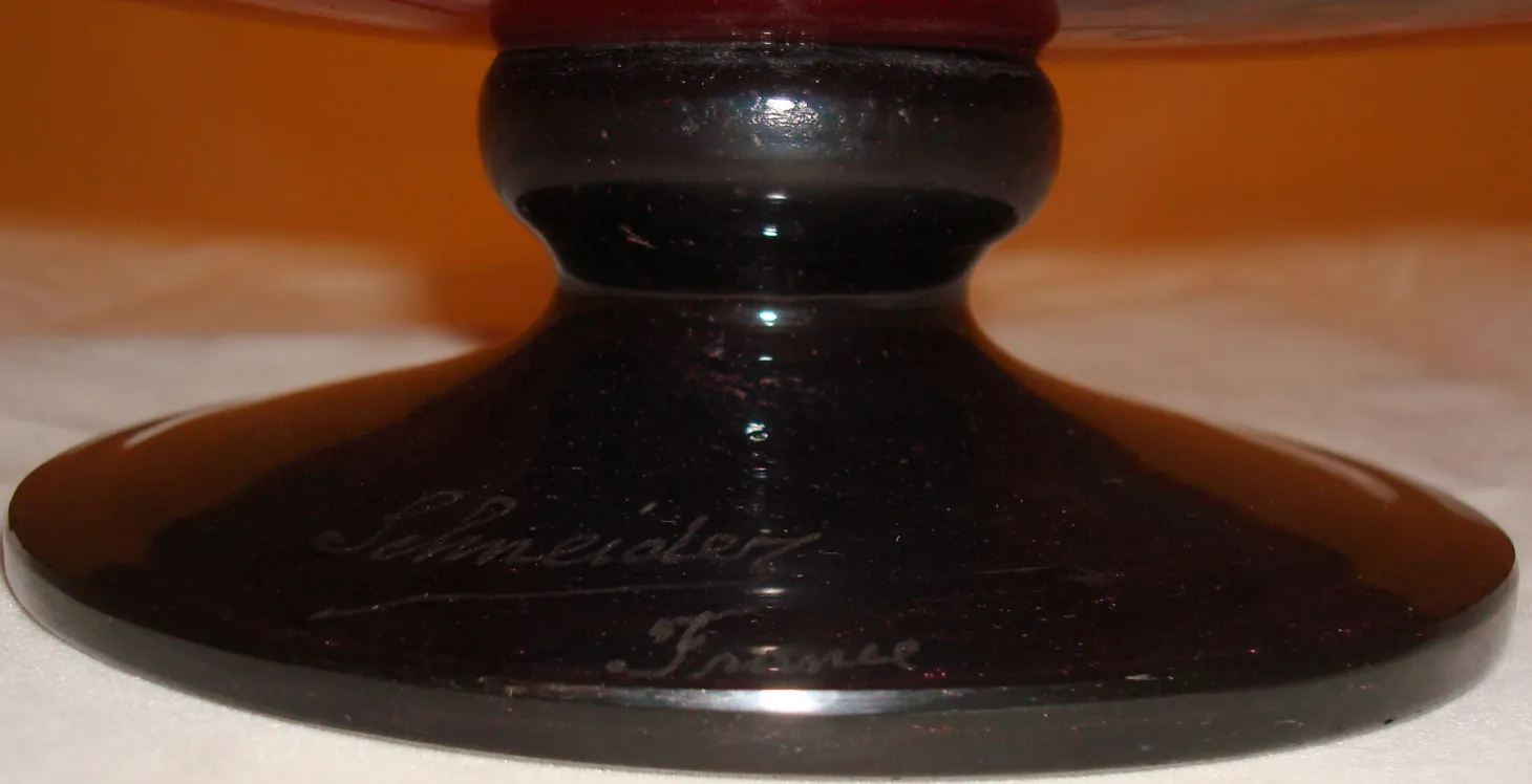 signed glass with an elegant dark base, features Schneider's signature and 'France' on the bottom