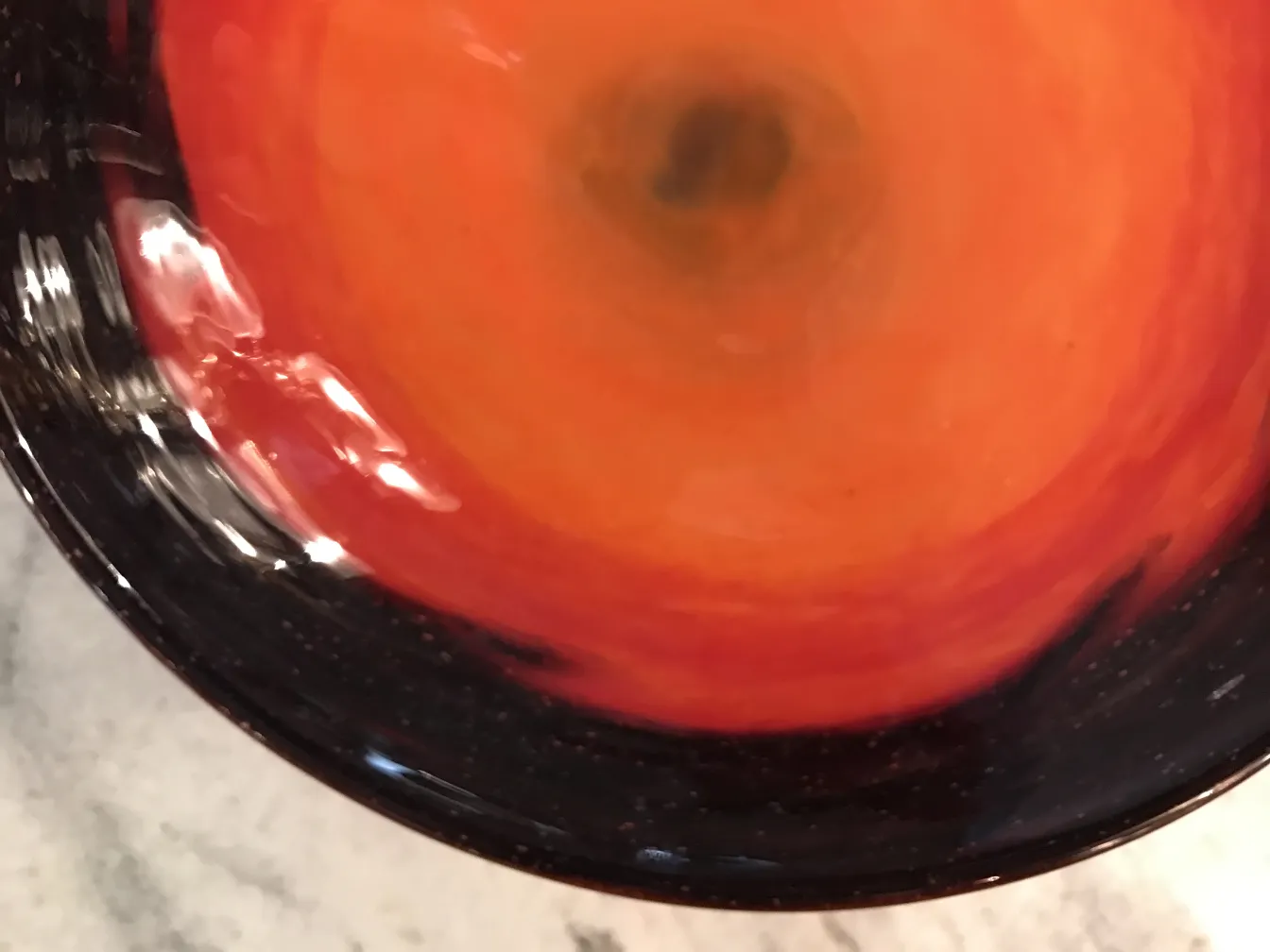 Signed glass by Schneider, featuring red and black tones.