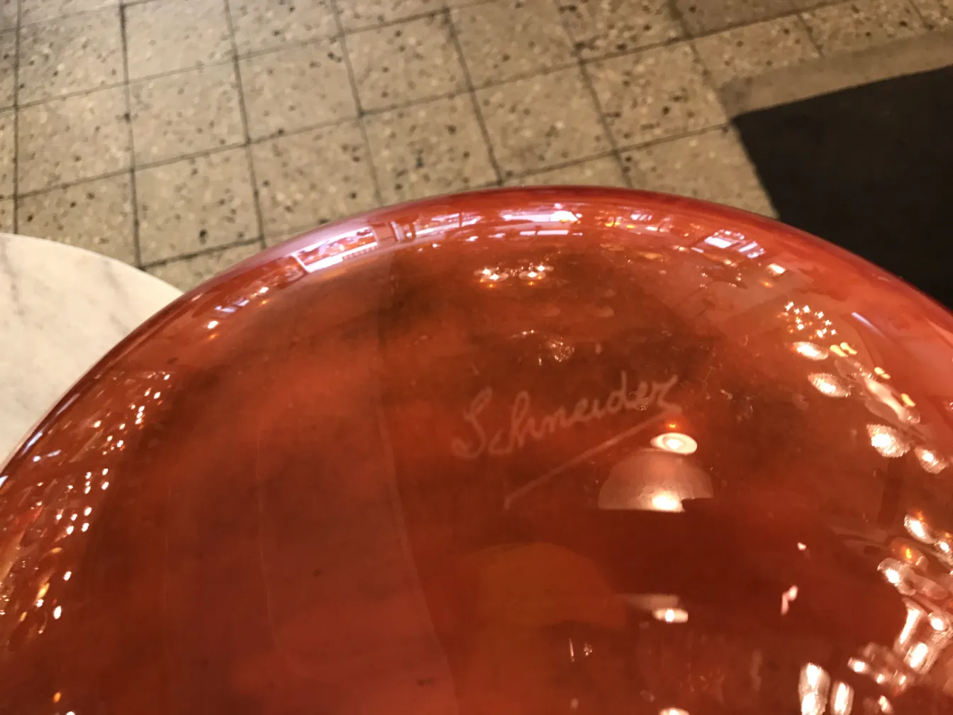 Antique glass with Schneider signature, clear and glossy.
