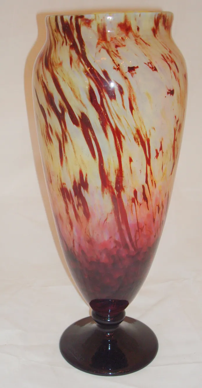 elegantly signed glass with striking warm color design