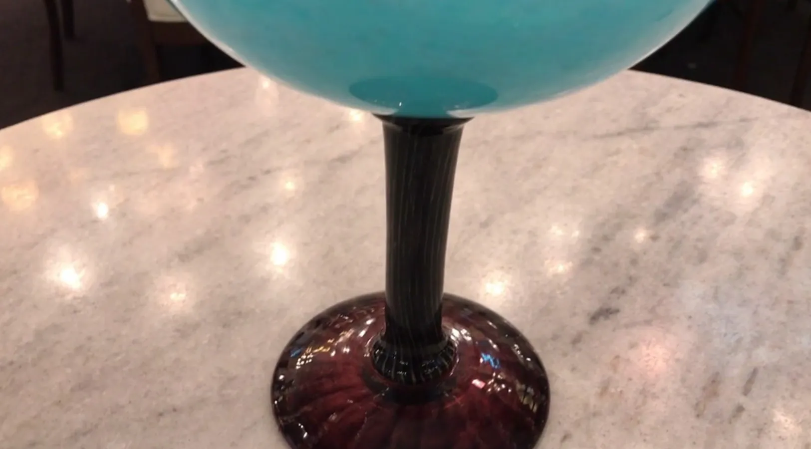 Antique signed glass by Schneider, featuring a dark base and blue color.