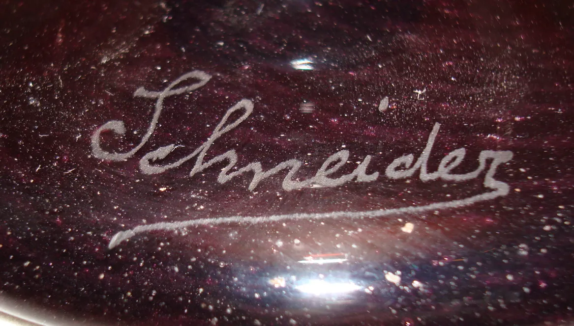 Antique signed glass by Schneider featuring an elegant and unique design.