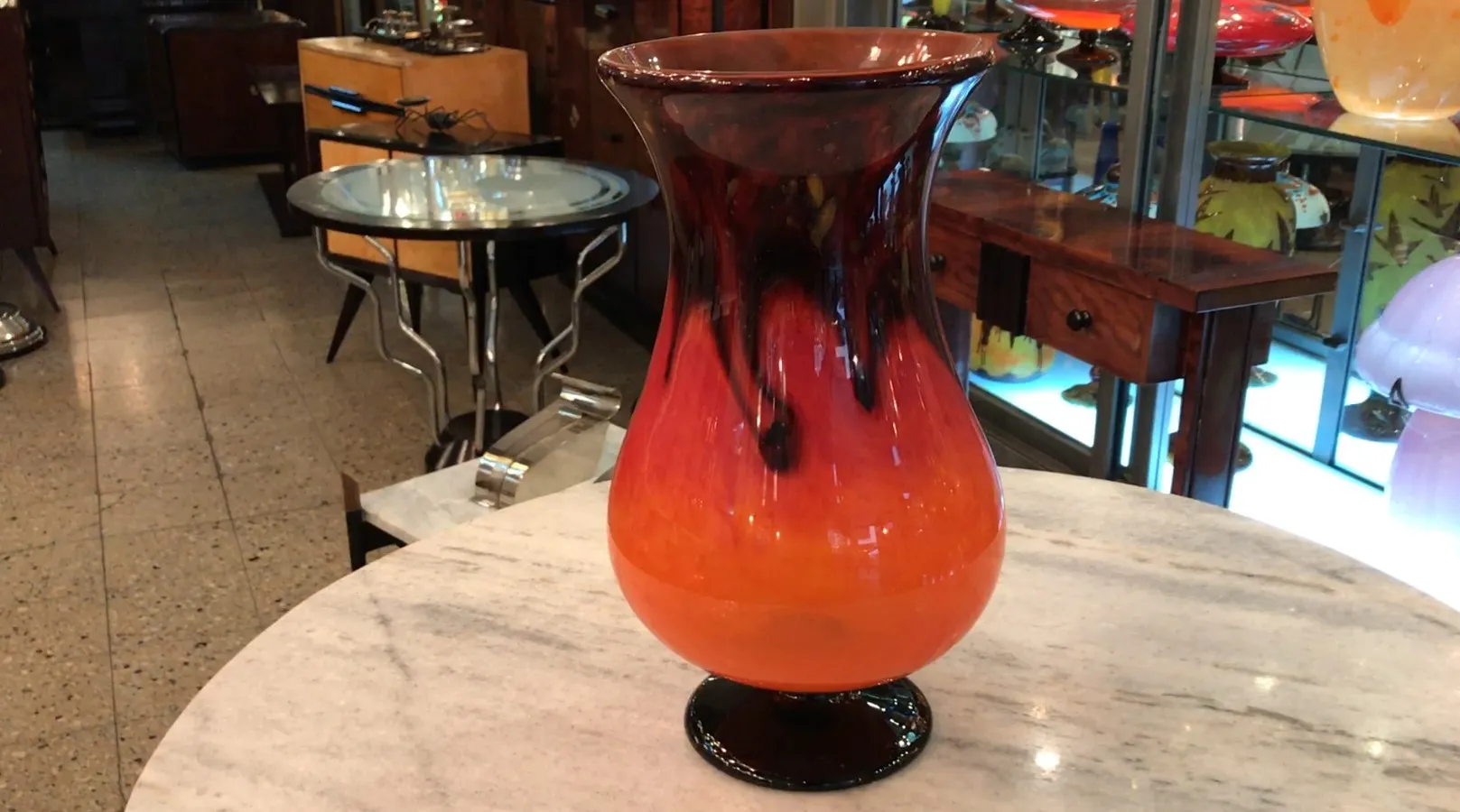 The antique signed glass showcases vibrant colors, highlighting the ambiance