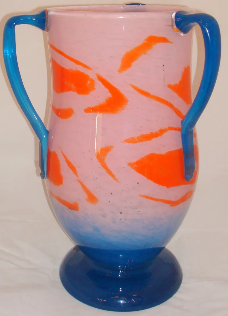 Decorative vase in glass featuring colorful design and beautiful finish.