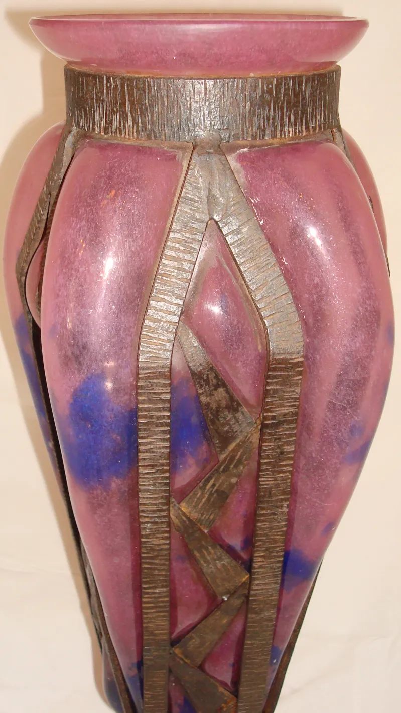 Decorative antique signed glass by Schneider with purple and blue hues.