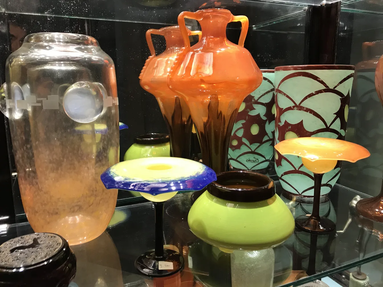 Signed glass Schneider with artistic details in color and shape, antique setting.