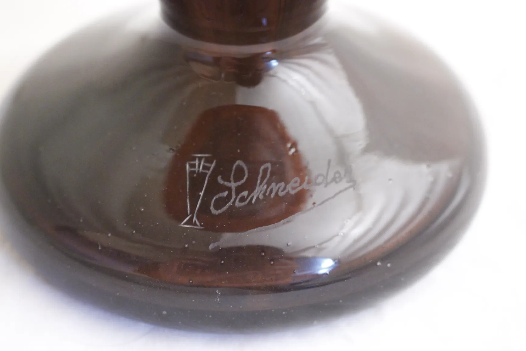 Signed glass with Schneider's signature in dark color, antique.