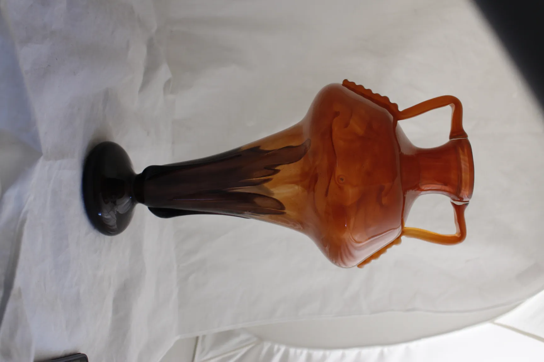 glass signed with elegant design and dark base