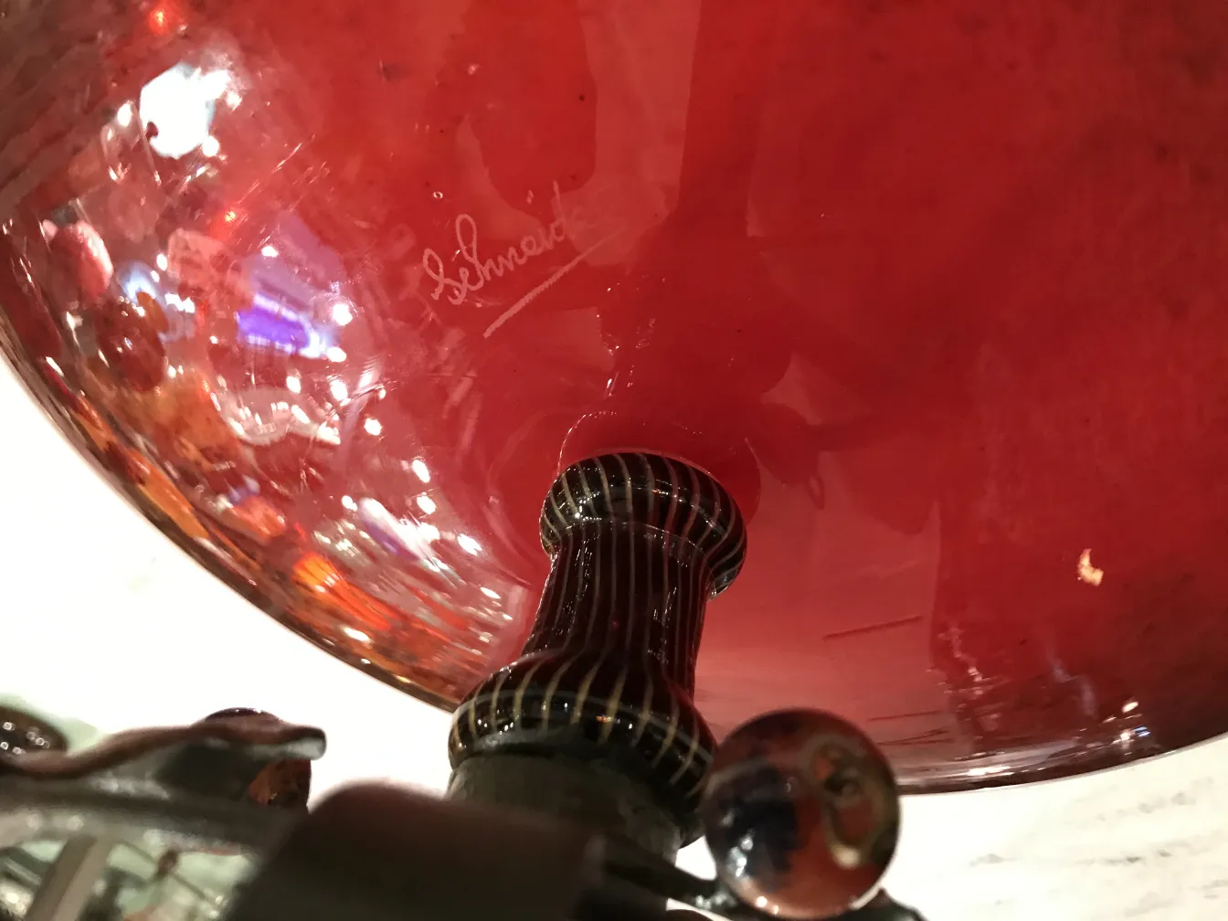 Red glass with signature of Schneider, antique setting