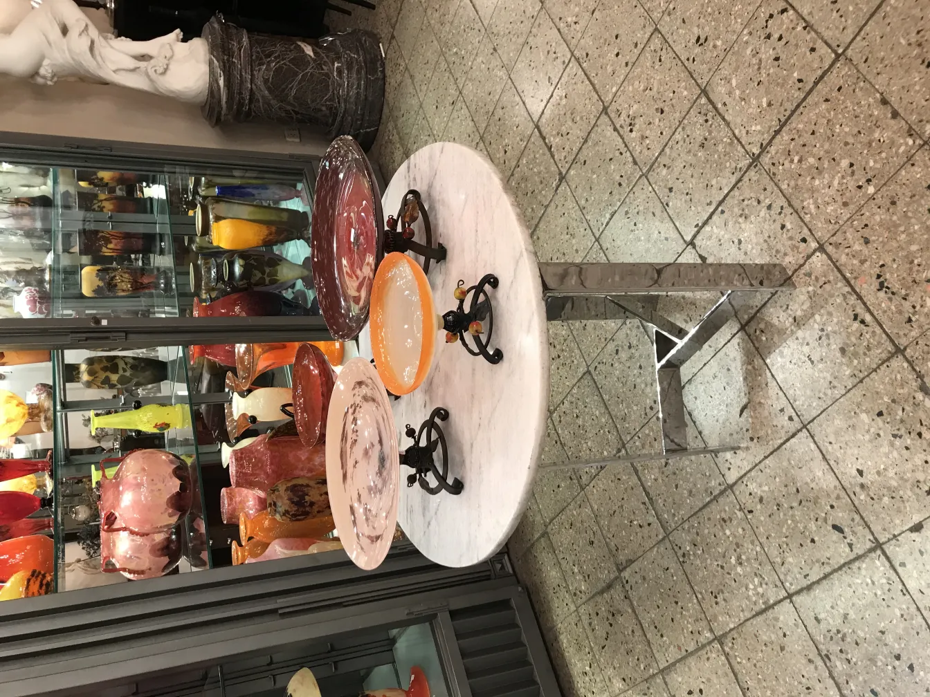 rounded glass signed on decorative table