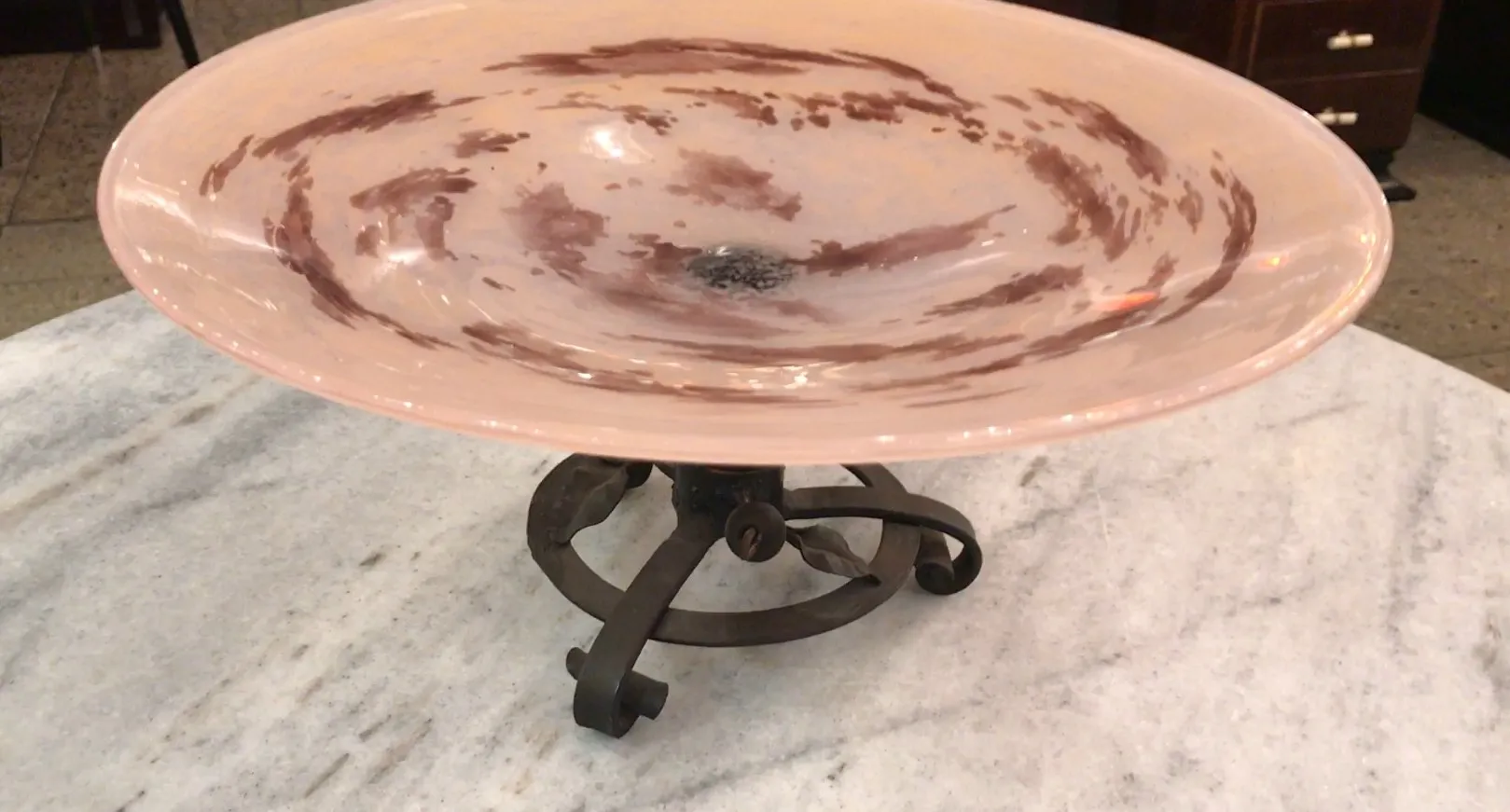 Antique signed glass Schneider with decorative base, soft tones.