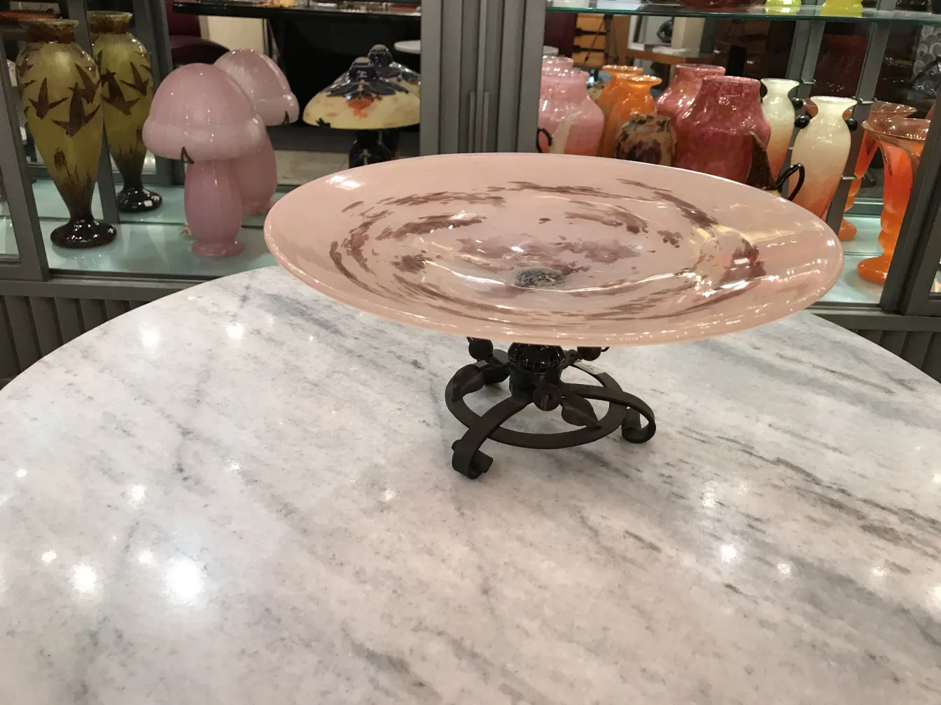 Decorative plate of signed glass by Schneider in an antique environment.