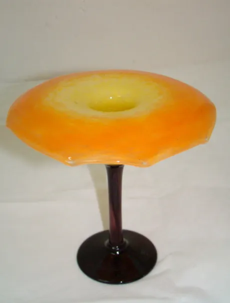 Colorful signed glass on tall base with unique design