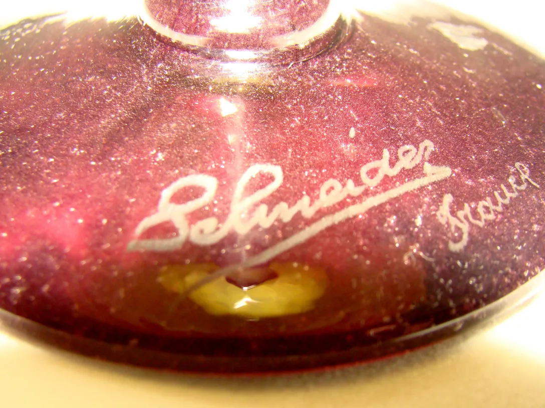 Signed glass with shimmering purple, antique setting