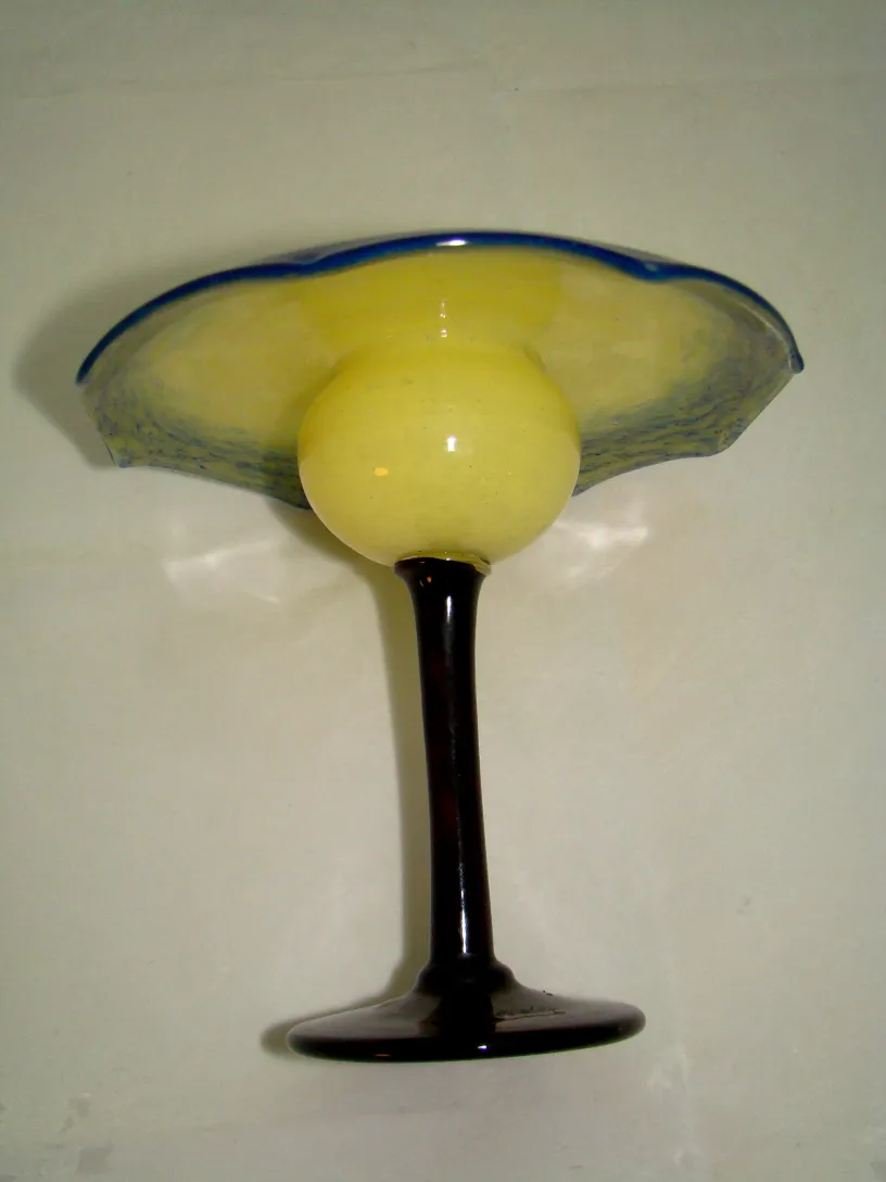 antique signed glass with a black base and yellow hue