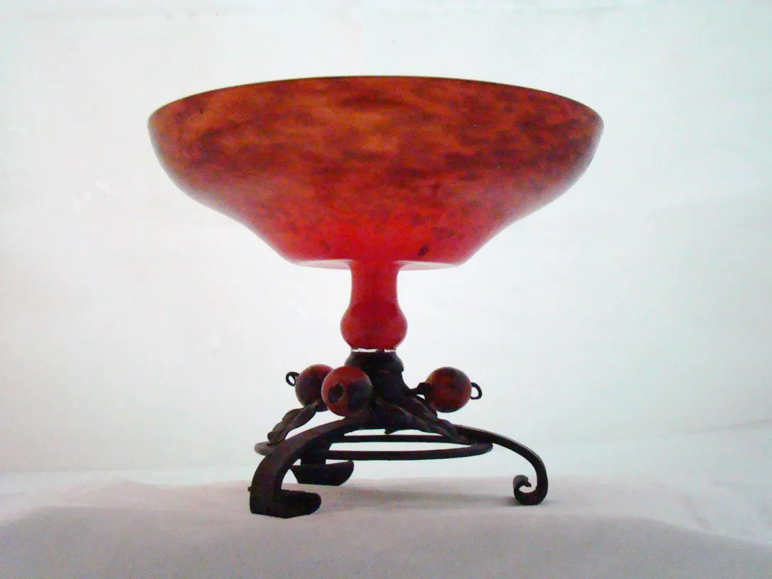 Antique glass with Schneider signature, decorative metal base.
