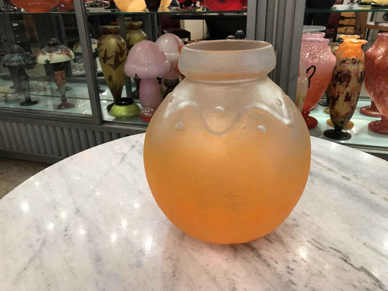 signed glass with classic design in orange color