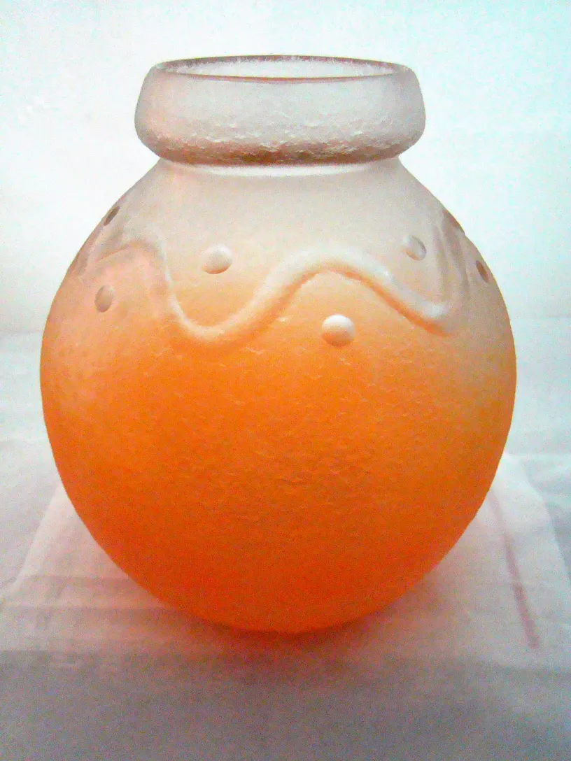 glass in orange tones with decorative details