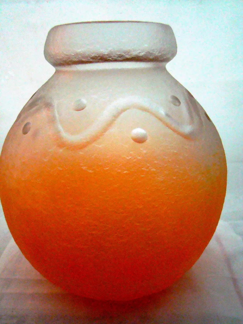 antique glass with Schneider signature, wavy design, orange color