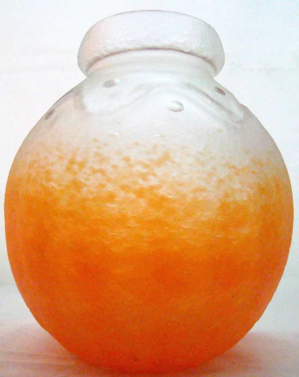 antique signed glass with orange details and round shape
