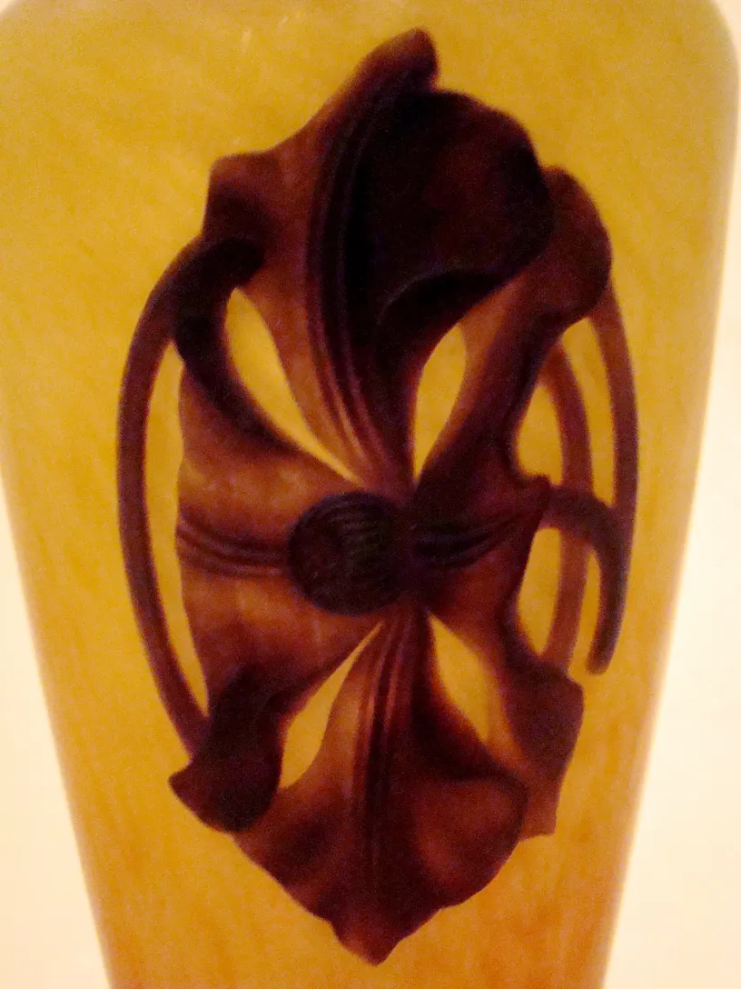 SIGNED GLASS Schneider with dark floral design on light background, decorative antique