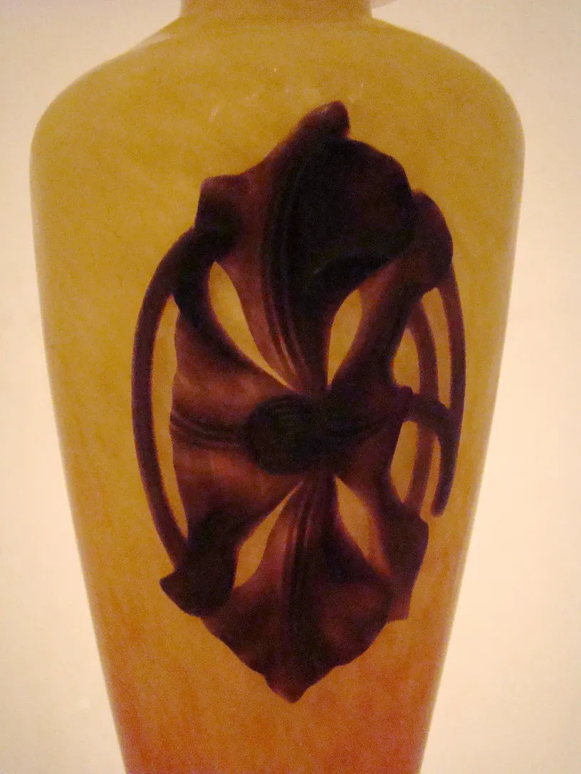 Antique glass signed with dark floral design.